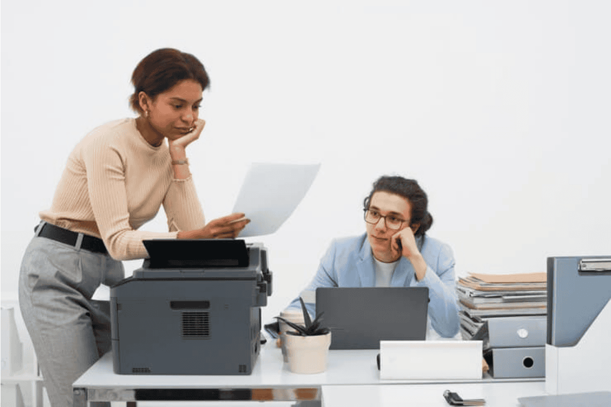 workers near laser printer