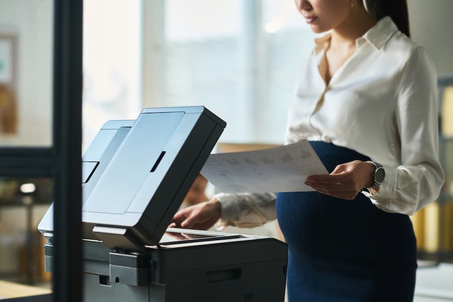 Woman making copies on an office copier