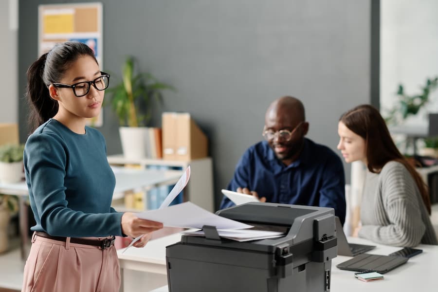 Office team working near a shared copier